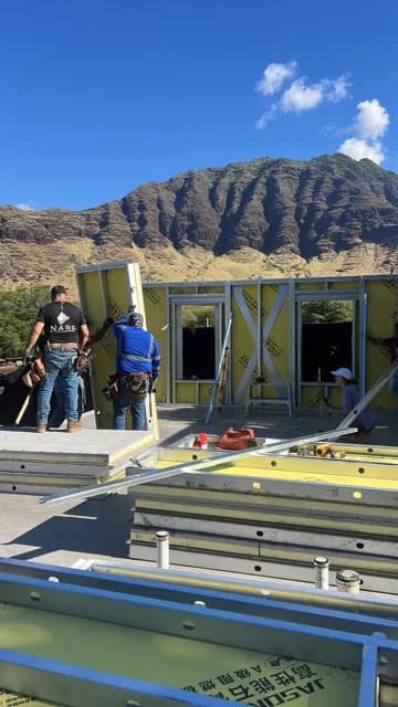 Tall Builders crew at work beneath the Waiʻanae mountains