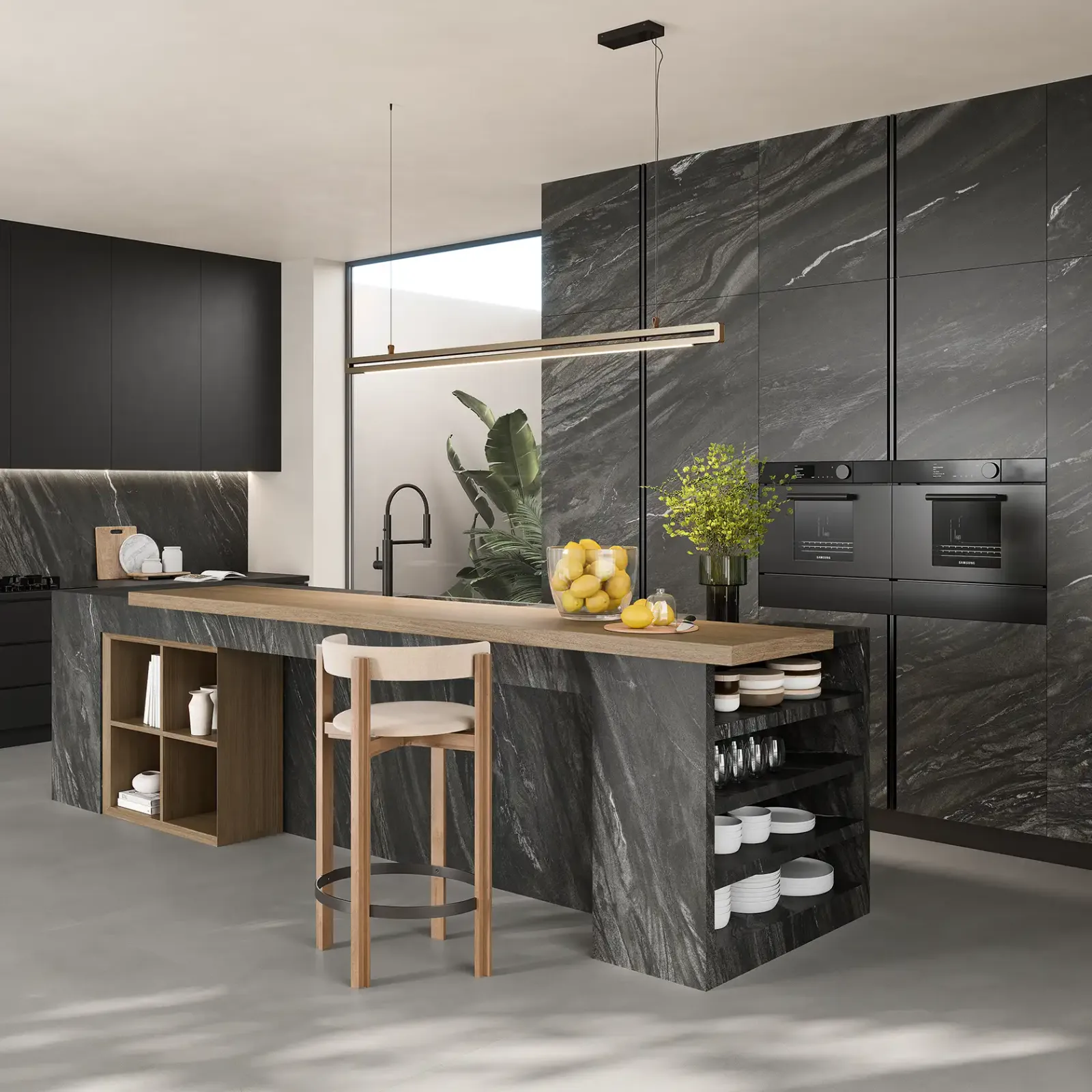 Modern kitchen with dark marble-look porcelain slab island, matte black cabinetry, and wood countertop from Susanna Cabinets & Stone